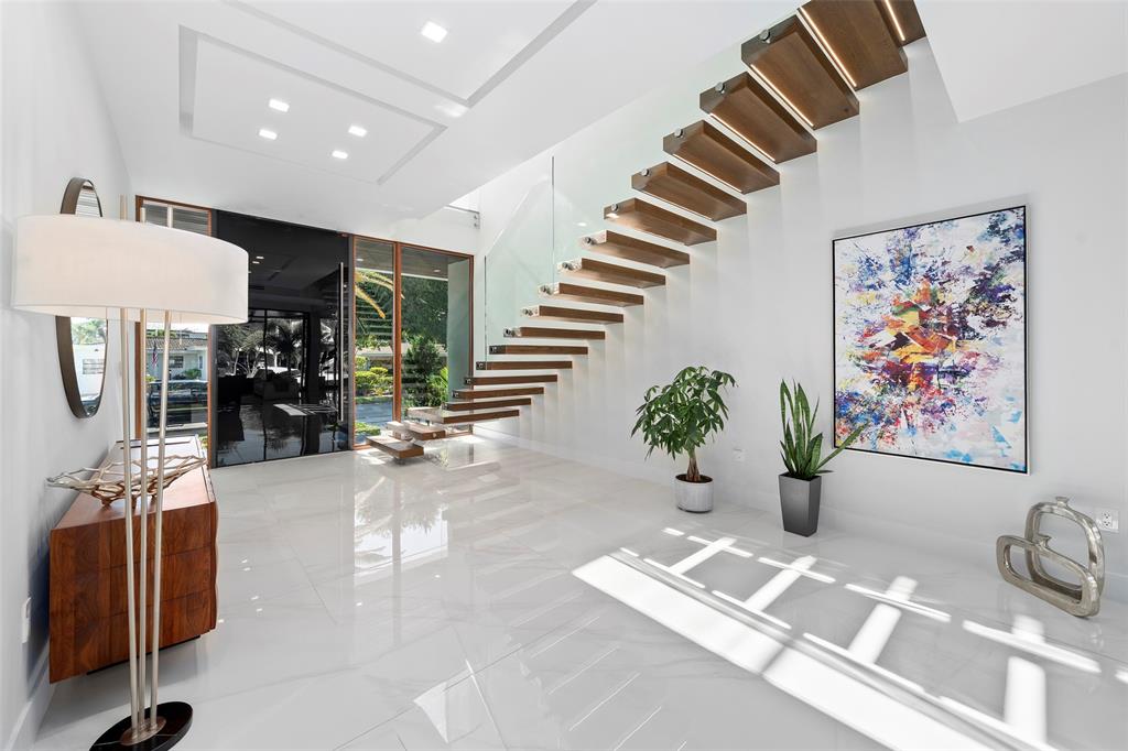2631 Northeast 48th Court Lighthouse Point, FL 33064 - Photo 21 of 74 a view of entryway livingroom and hall
