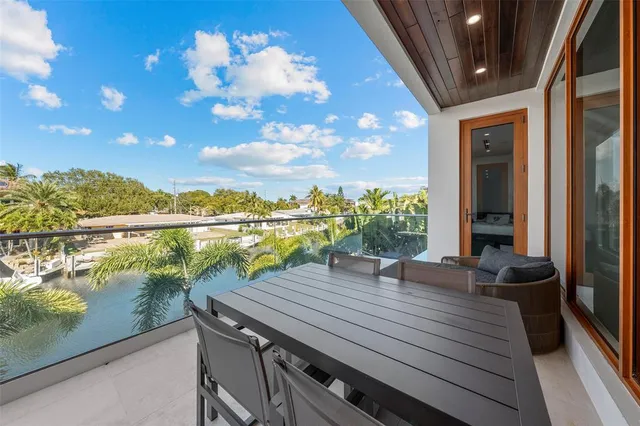 a bedroom with two large bed and a large window