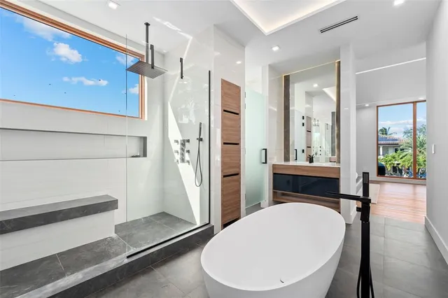 a bathroom with a tub and shower
