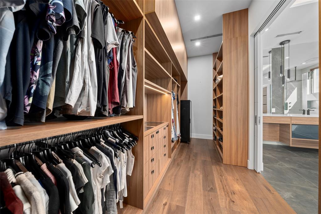 2631 Northeast 48th Court Lighthouse Point, FL 33064 - Photo 36 of 74 a view of walk in closet with clothes and shoes