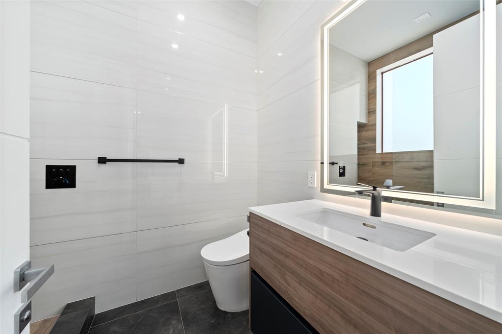 2631 Northeast 48th Court Lighthouse Point, FL 33064 - Photo 44 of 74 a bathroom with a sink and a mirror