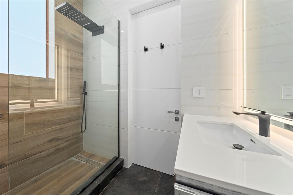 2631 Northeast 48th Court Lighthouse Point, FL 33064 - Photo 51 of 74 a bathroom with a tub and shower