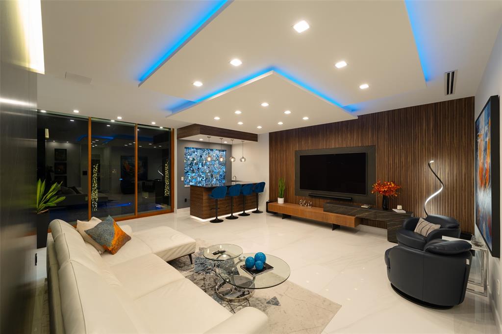 2631 Northeast 48th Court Lighthouse Point, FL 33064 - Photo 53 of 74 a living room with furniture and a flat screen tv