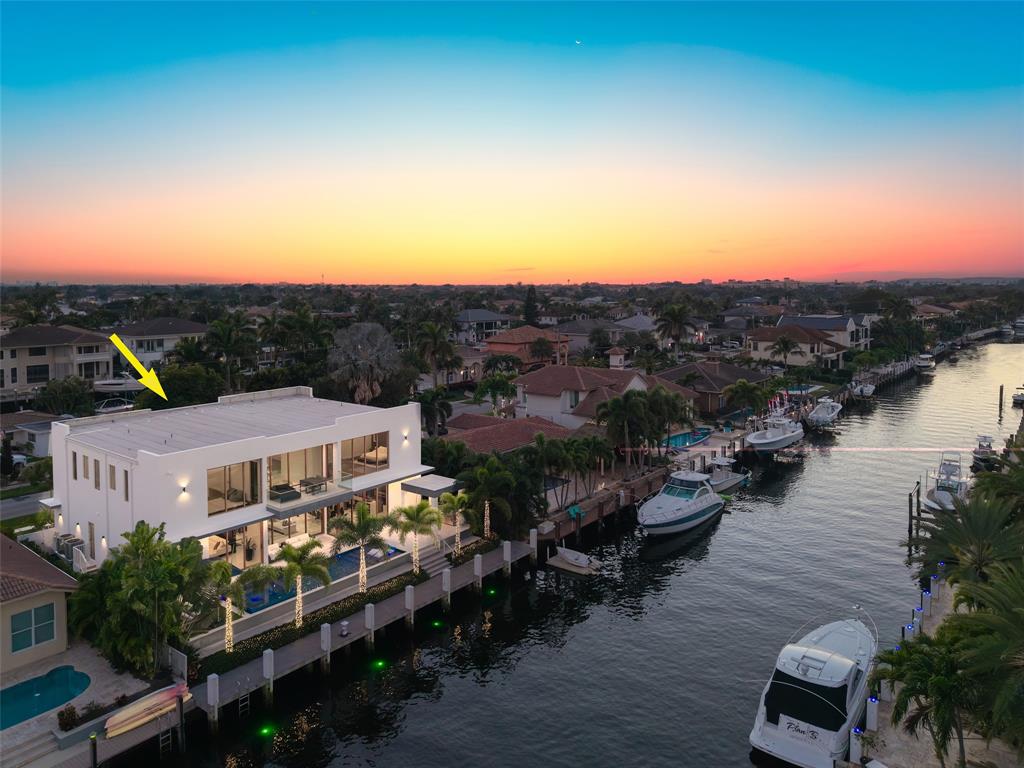 2631 Northeast 48th Court Lighthouse Point, FL 33064 - Photo 58 of 74 an aerial view of a house with a garden