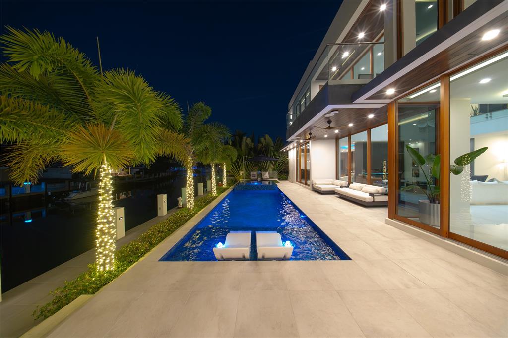 2631 Northeast 48th Court Lighthouse Point, FL 33064 - Photo 59 of 74 a view of swimming pool with a patio