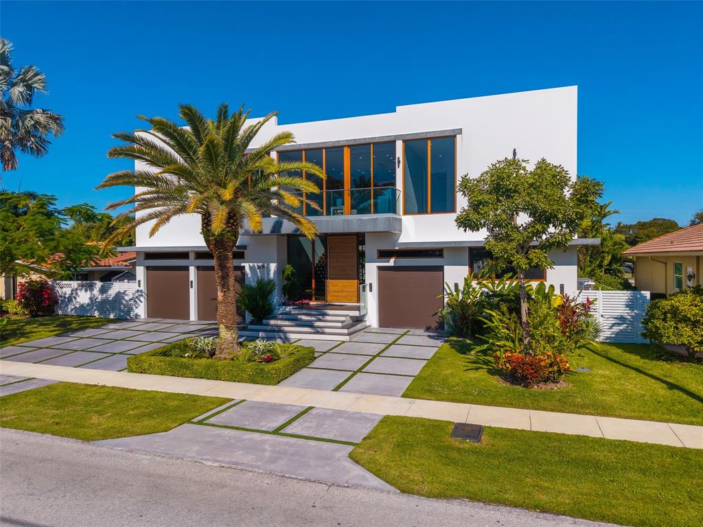 2631 Northeast 48th Court Lighthouse Point, FL 33064 - Photo 71 of 74 a front view of a house with swimming pool and porch