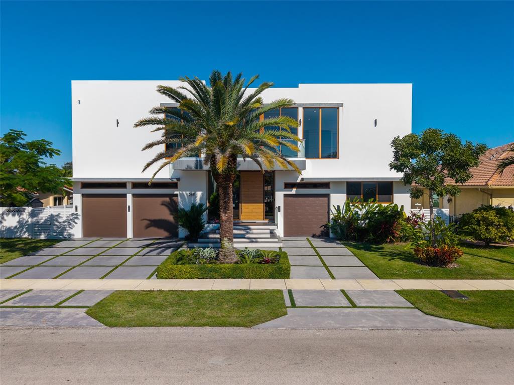 2631 Northeast 48th Court Lighthouse Point, FL 33064 - Photo 73 of 74 a front view of a house with garden