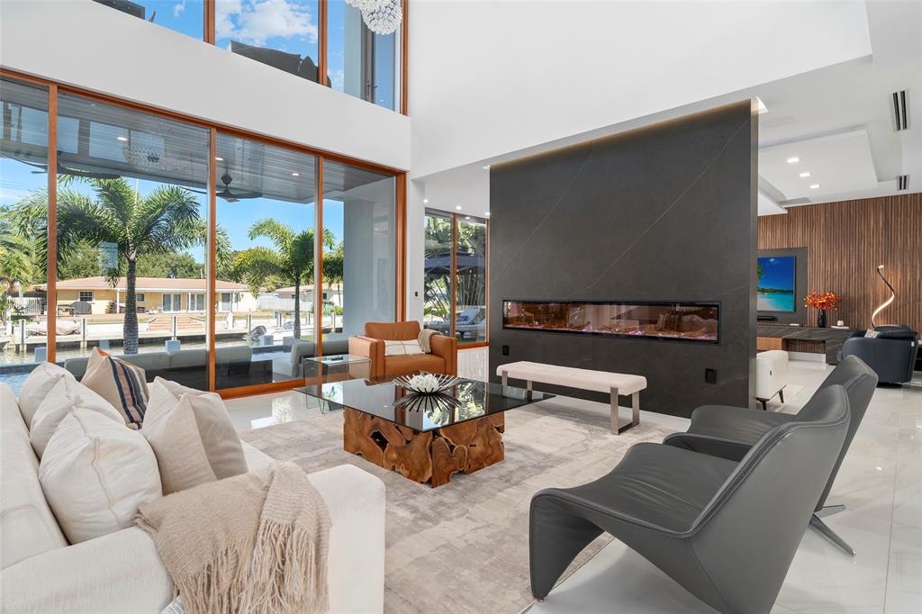 2631 Northeast 48th Court Lighthouse Point, FL 33064 - Photo 8 of 74 a living room with furniture and a large window