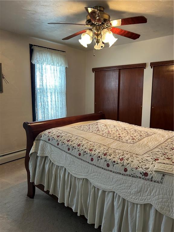 419 Indiana Avenue Monessen, PA 15062 - Photo 13 of 19 a bedroom with a bed and a chandelier