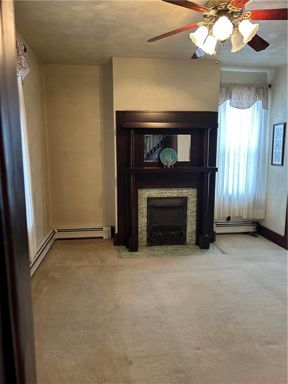 419 Indiana Avenue Monessen, PA 15062 - Photo 4 of 19 a view of an empty room with a fireplace and a window