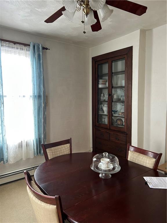 419 Indiana Avenue Monessen, PA 15062 - Photo 7 of 19 a table and a vase of flowers sitting on a table