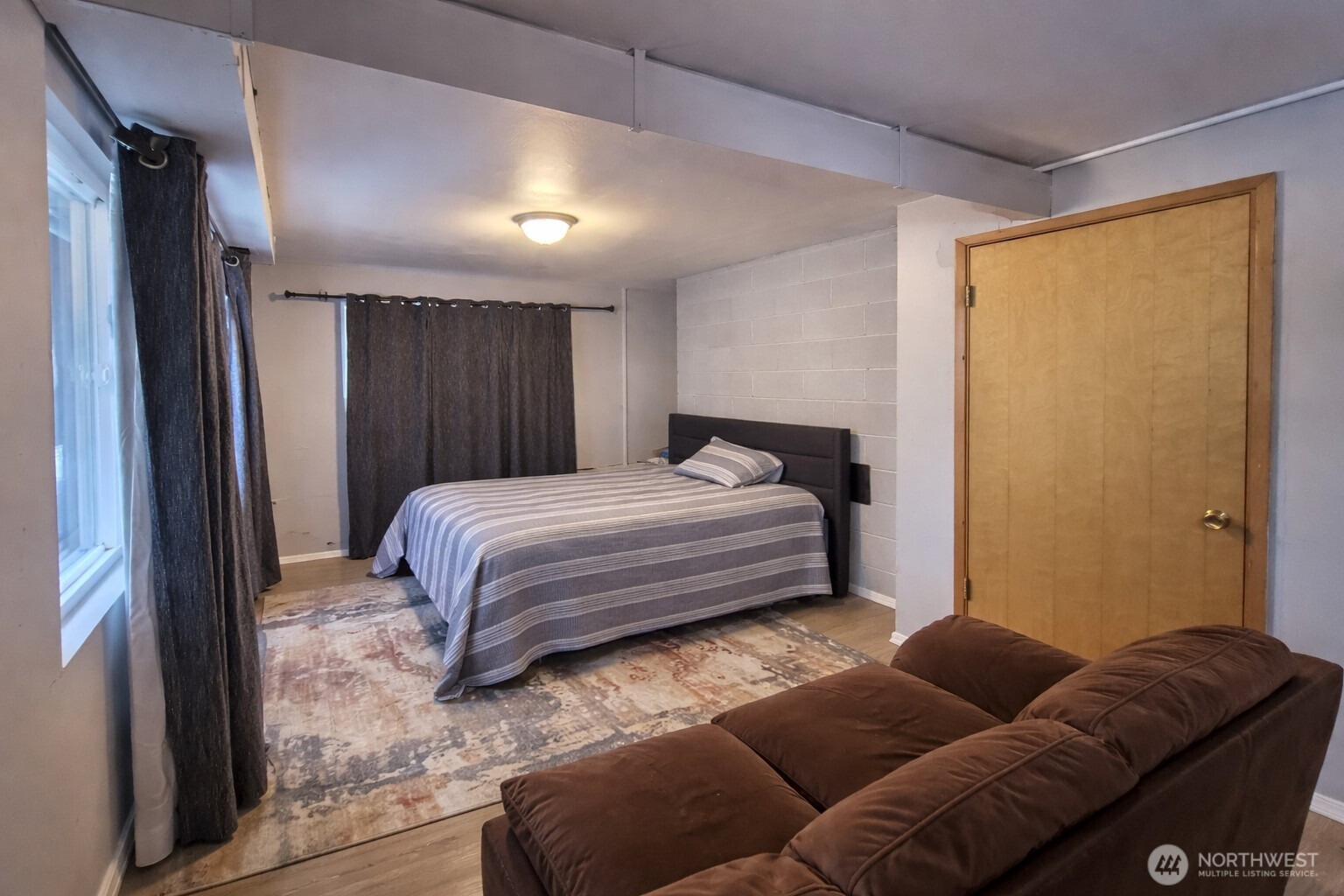 14600 Southeast 181st Street Renton, WA 98058 - Photo 17 of 39 a bedroom with a bed couch and a window