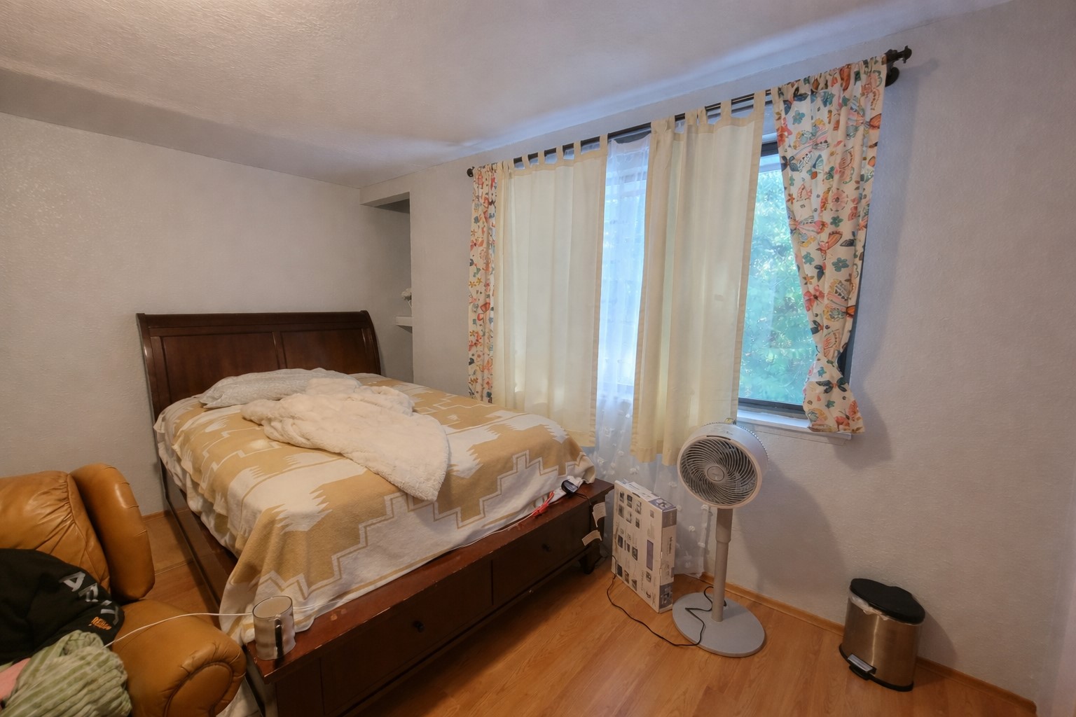 14600 Southeast 181st Street Renton, WA 98058 - Photo 22 of 39 a bed sitting in a bedroom next to a window and a chair