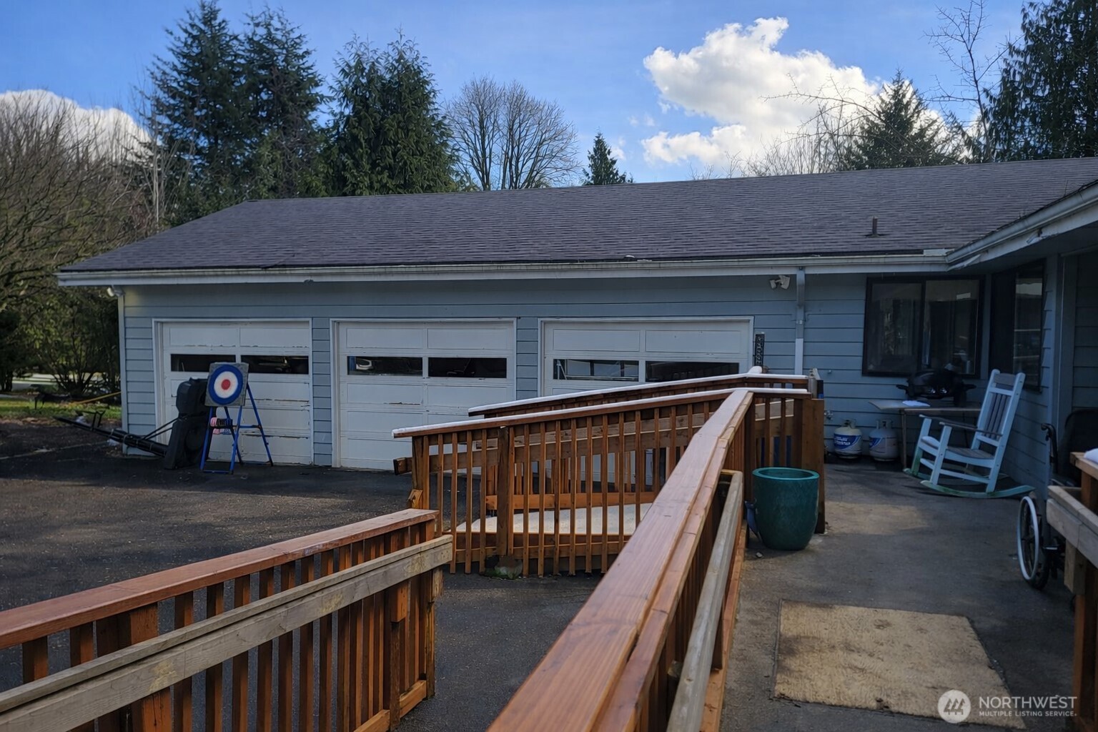14600 Southeast 181st Street Renton, WA 98058 - Photo 33 of 39 a view of a roof deck with table and chairs with wooden floor and fence