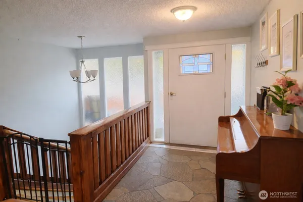 a kitchen with a sink cabinets stainless steel appliances and a window