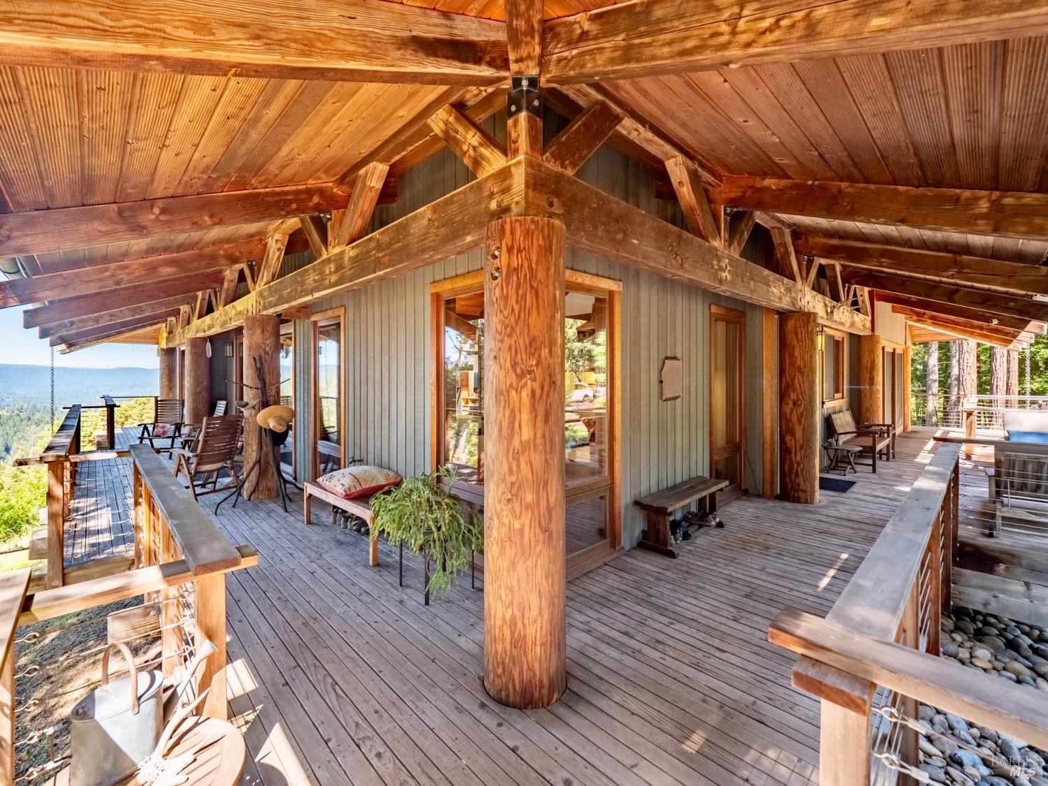 10951 Big Meadow Road Philo, CA 95466 - Photo 21 of 46 Expansive wraparound deck beckons you to linger while savoring a good book or entertaining loved ones.