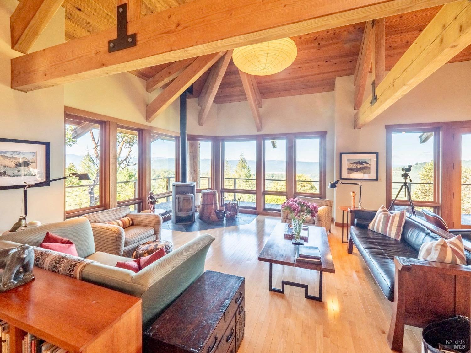 10951 Big Meadow Road Philo, CA 95466 - Photo 4 of 46 Walls of windows flood the interior with natural light and frame the sweeping vistas beyond.