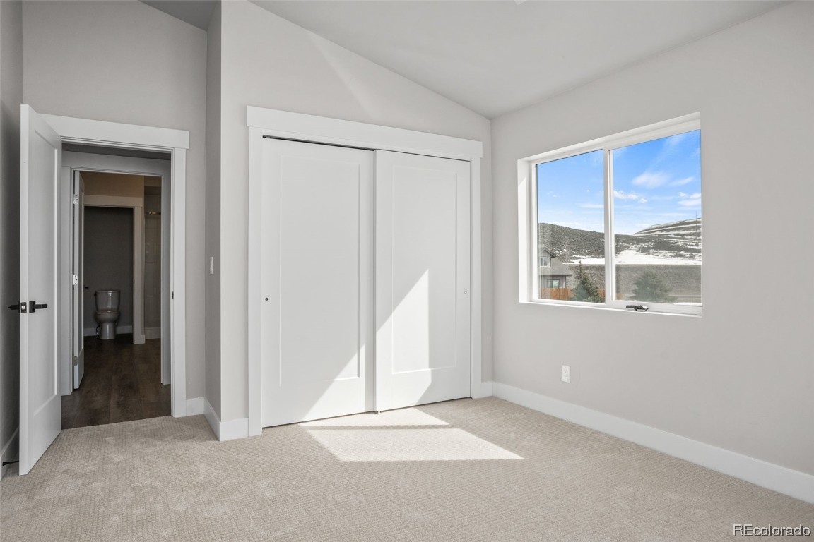 932 Dry Creek Road Hayden, CO 81639 - Photo 14 of 24 an empty room with a window and a ceiling fan