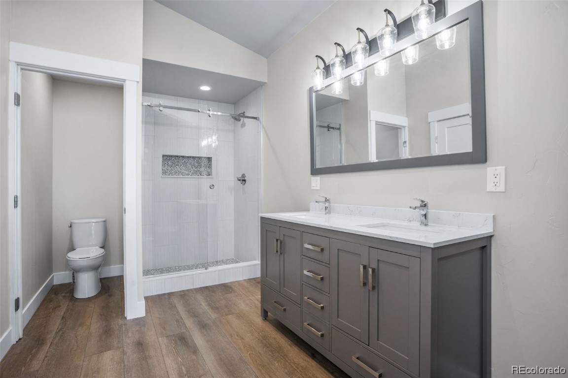 932 Dry Creek Road Hayden, CO 81639 - Photo 19 of 24 a bathroom with a sink a toilet and a mirror