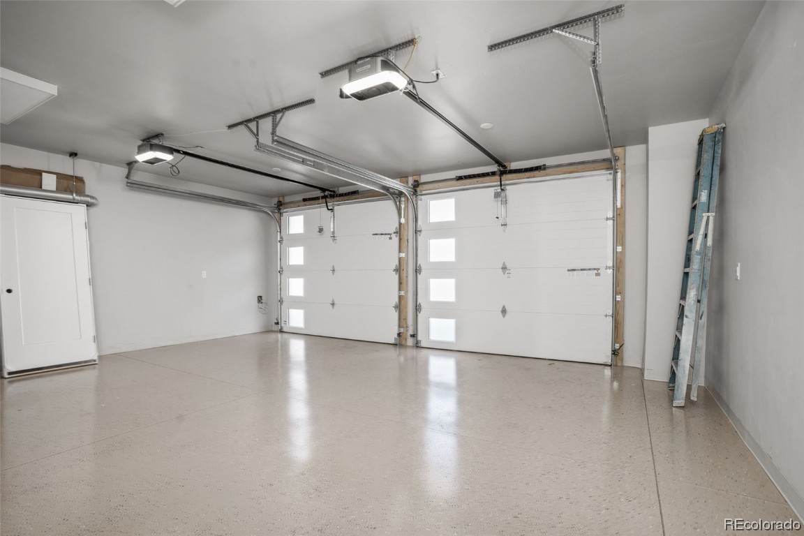932 Dry Creek Road Hayden, CO 81639 - Photo 23 of 24 an empty room with wooden floor and windows