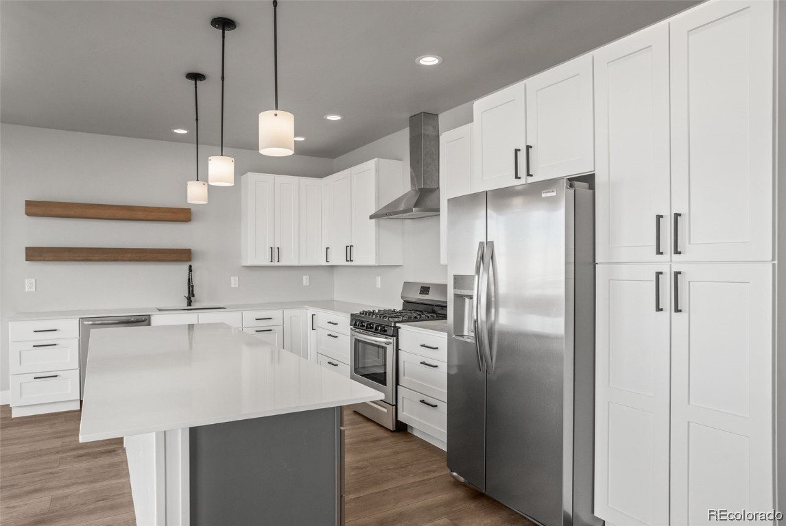 932 Dry Creek Road Hayden, CO 81639 - Photo 4 of 24 a kitchen with kitchen island a counter space stainless steel appliances and cabinets