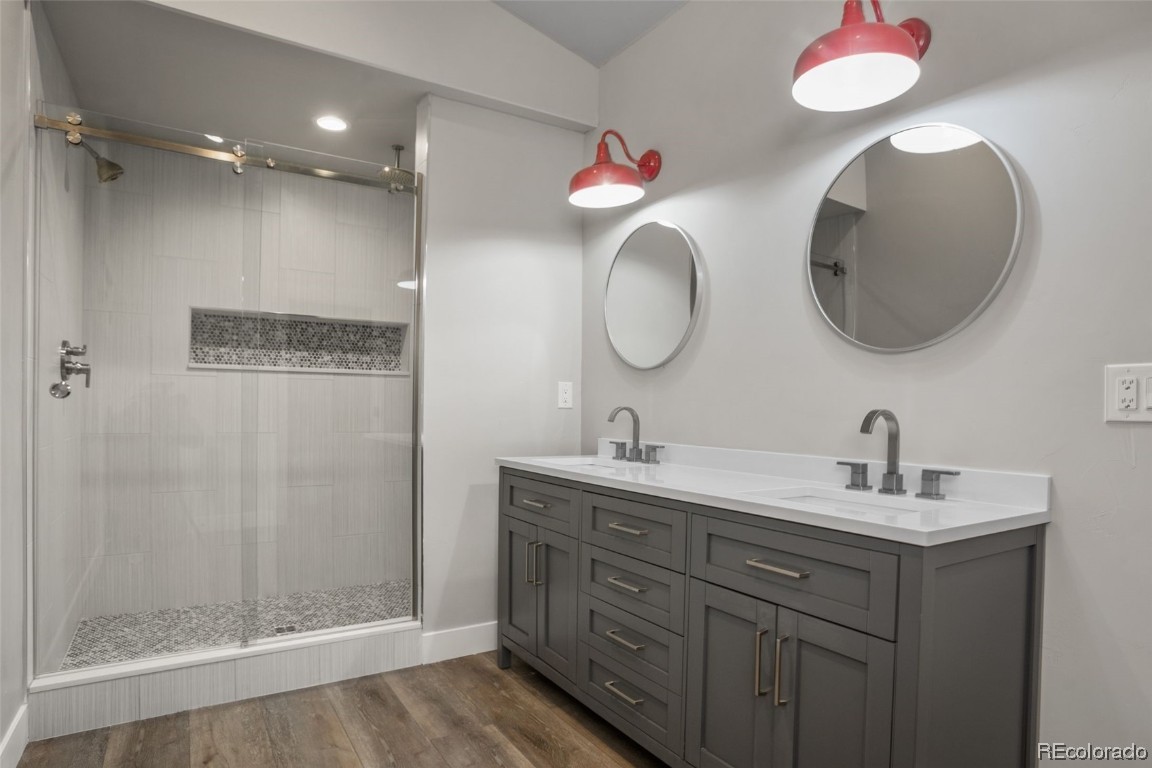 932 Dry Creek Road Hayden, CO 81639 - Photo 10 of 24 a bathroom with a double vanity sink mirror and shower