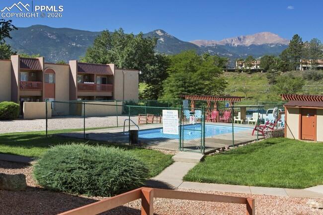 1018 Fontmore Road, Unit C Colorado Springs, CO 80904 - Photo 32 of 33 a view of a park that has a sign board large trees