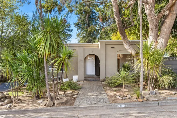 a front view of a house with garden
