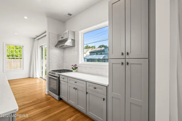a kitchen with a sink and cabinets