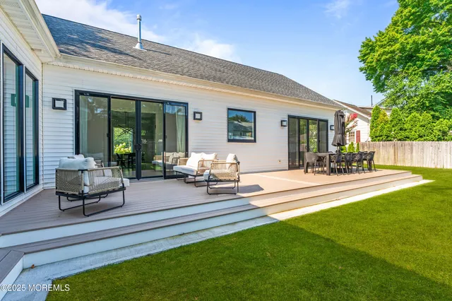 a building outdoor space with patio furniture and garden