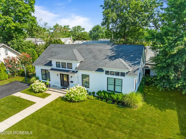 an aerial view of residential houses with city view