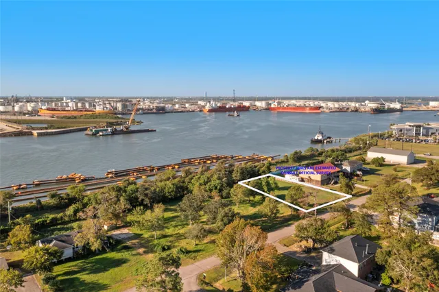 an aerial view of a residential building with outdoor space