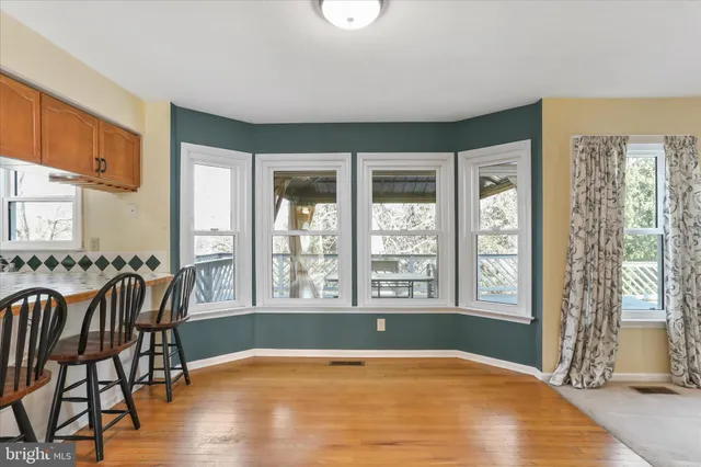 a view of a livingroom with furniture and hardwood floor
