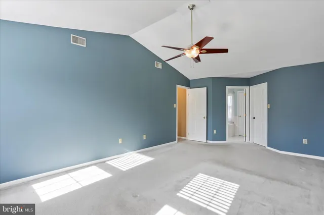 a bathroom with a tub a sink and a mirror