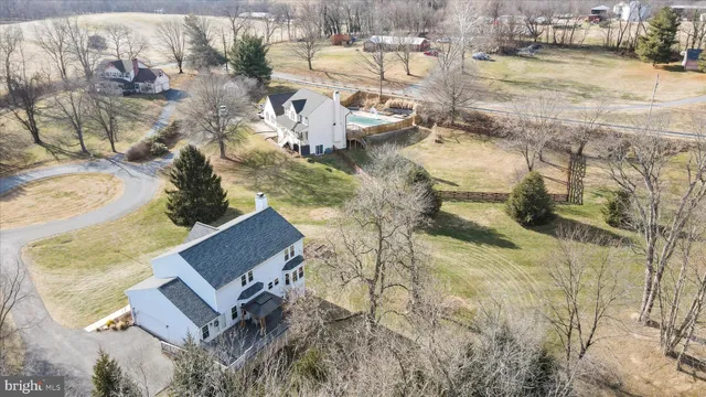 an aerial view of residential houses with outdoor space