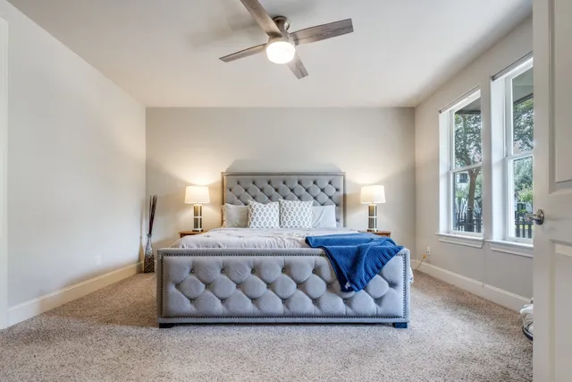 a bedroom with a bed and window