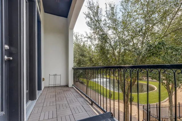 a view of balcony with wooden floor