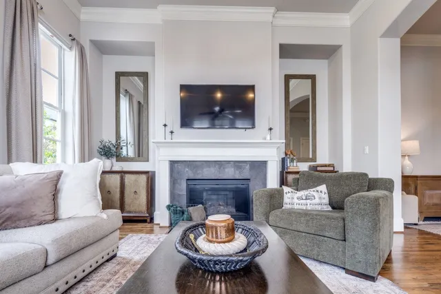 a living room with furniture and a fireplace
