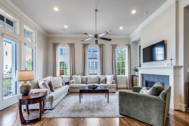 a living room with furniture fireplace and window