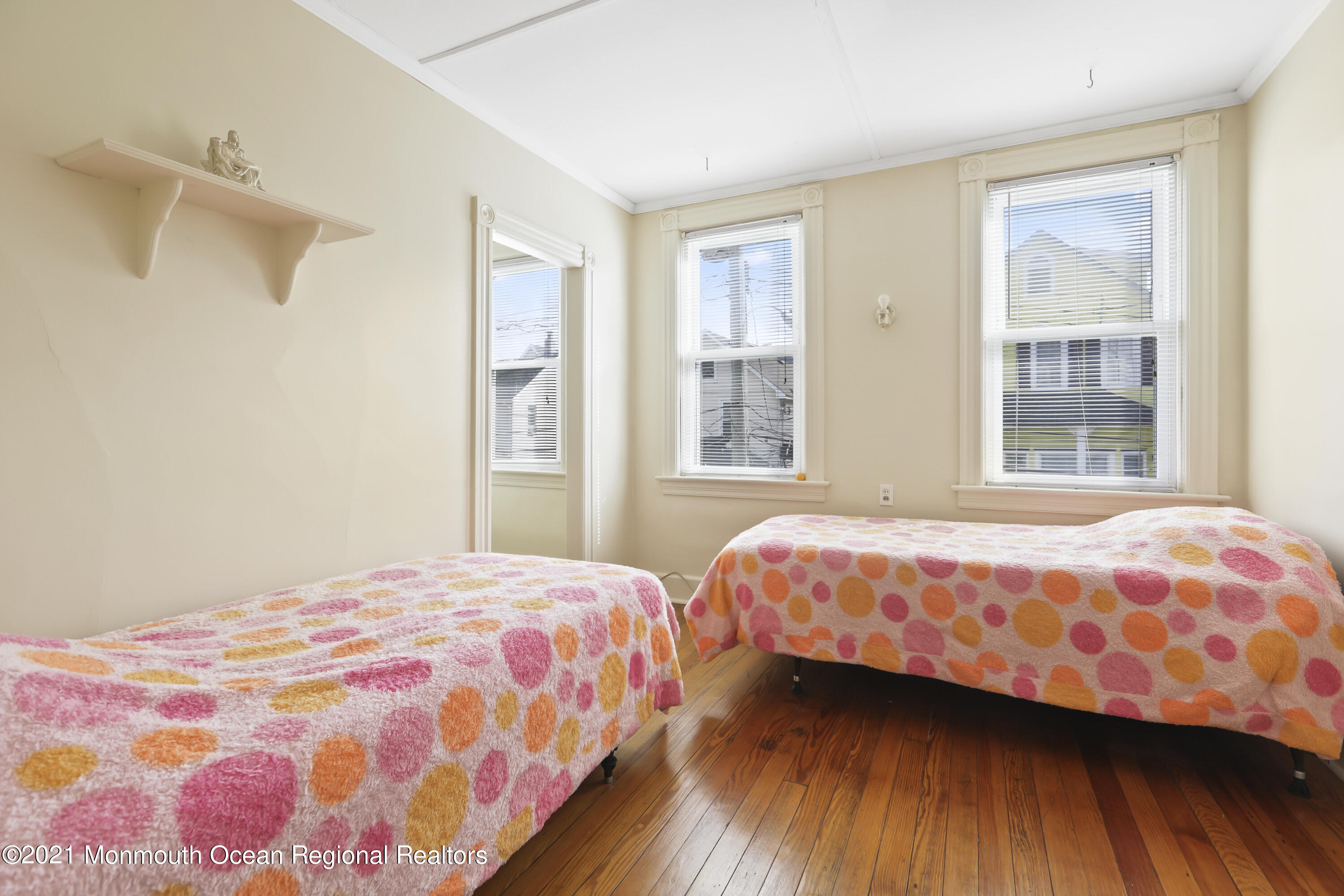 21 Center Street Sea Bright, NJ 07760 - Photo 11 of 21 a bedroom with a bed and a window