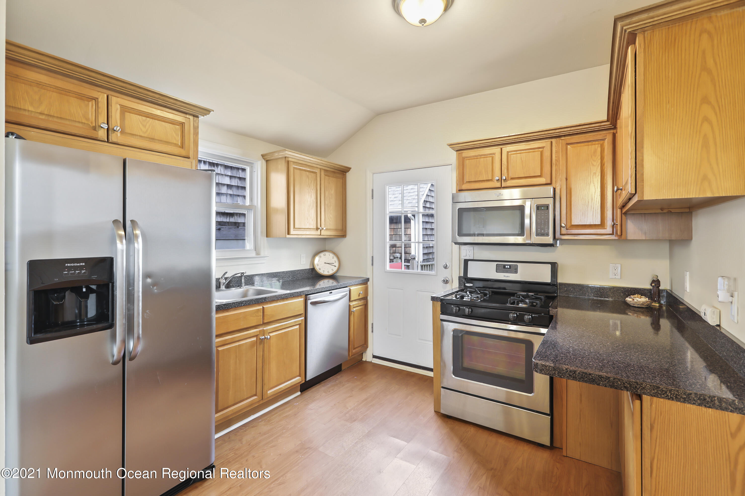 21 Center Street Sea Bright, NJ 07760 - Photo 5 of 21 a kitchen with stainless steel appliances granite countertop a refrigerator a stove and a sink