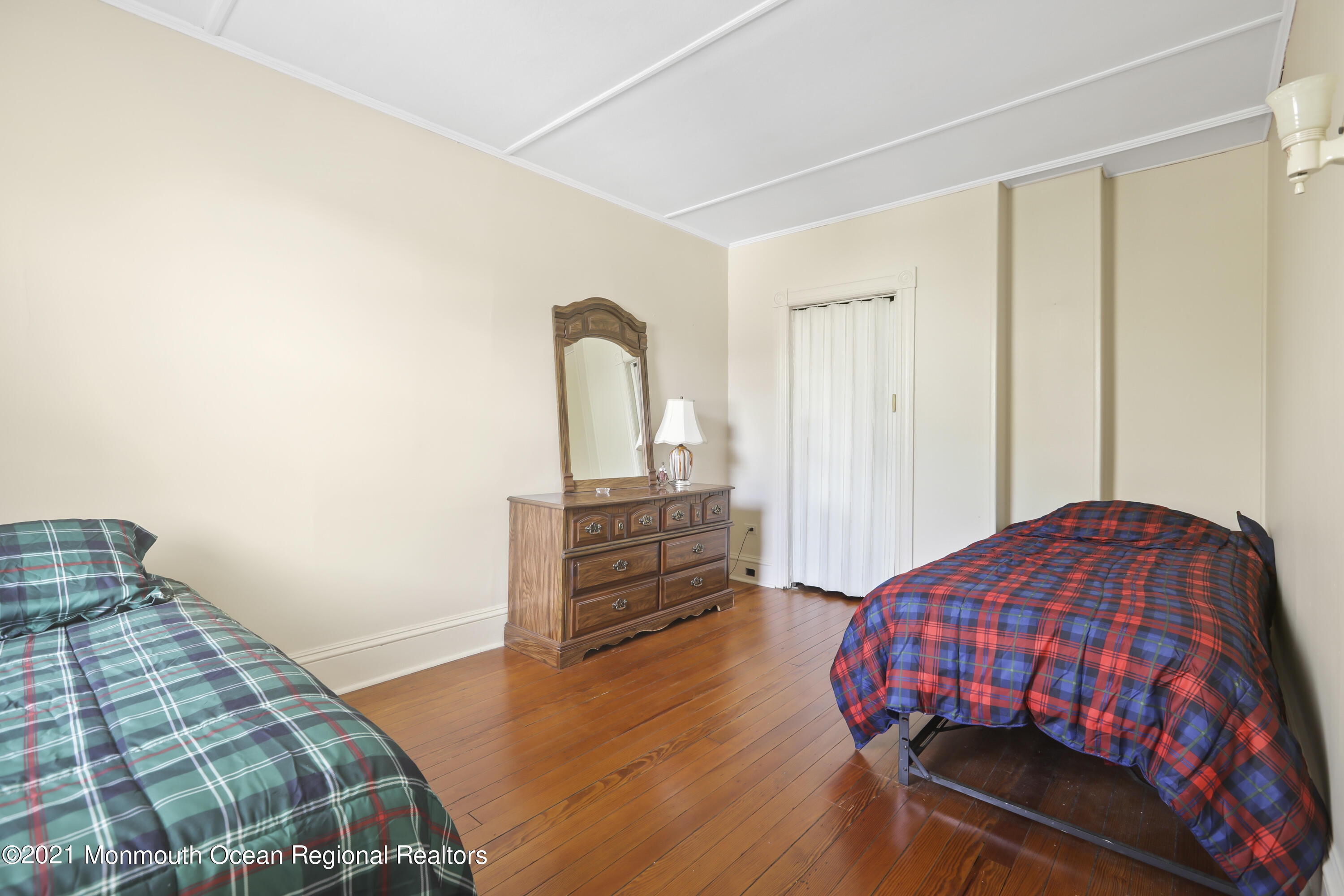 21 Center Street Sea Bright, NJ 07760 - Photo 8 of 21 a bedroom with a bed and wooden floor