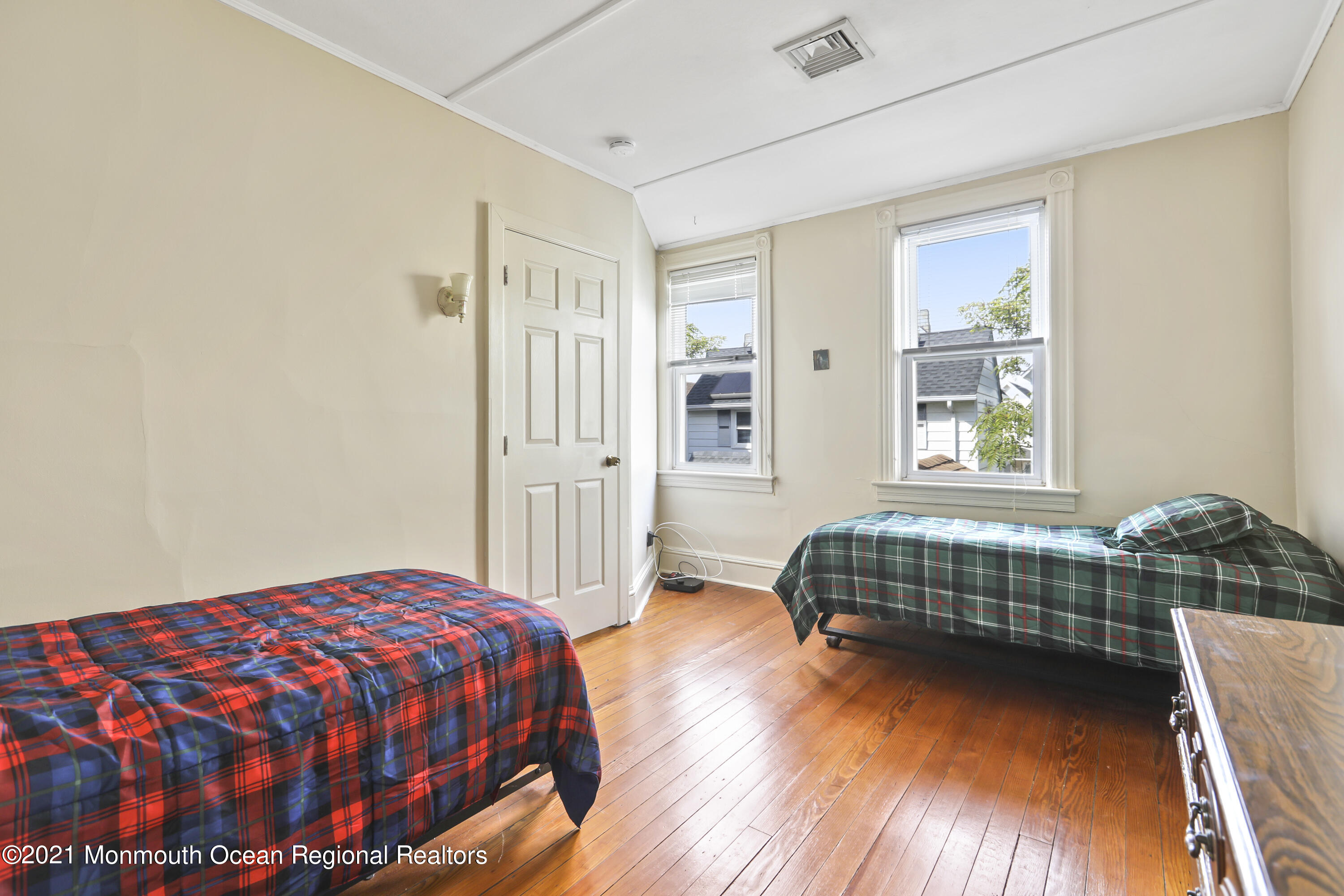21 Center Street Sea Bright, NJ 07760 - Photo 9 of 21 a bedroom with a bed and a window