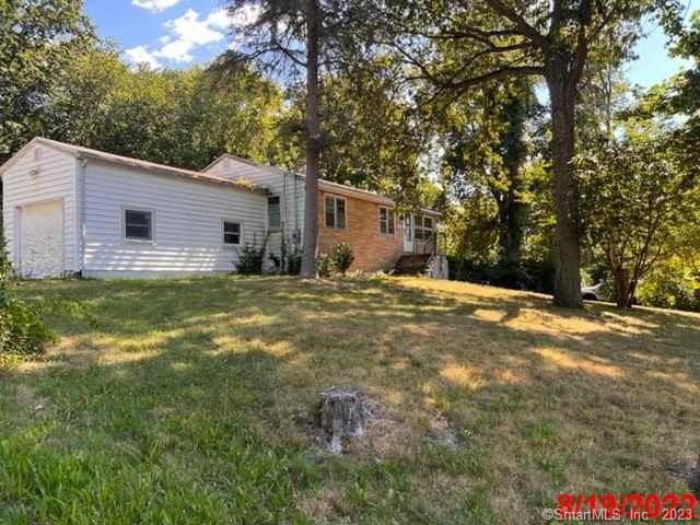 126 Clinton Hill Road Wolcott, CT 06716 - Photo 1 of 1 a view of a house with a yard