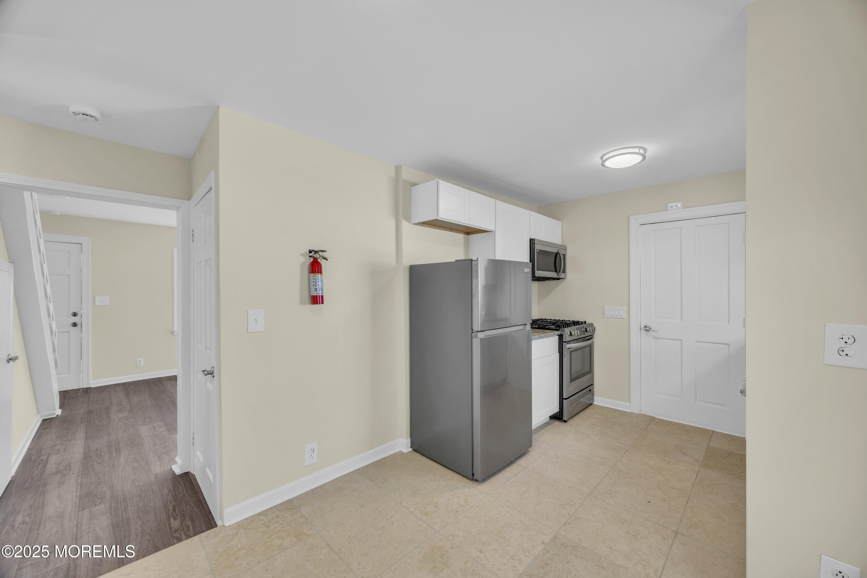 11 Randolphville Road Piscataway, NJ 08854 - Photo 11 of 27 a view of kitchen with refrigerator and wooden floor