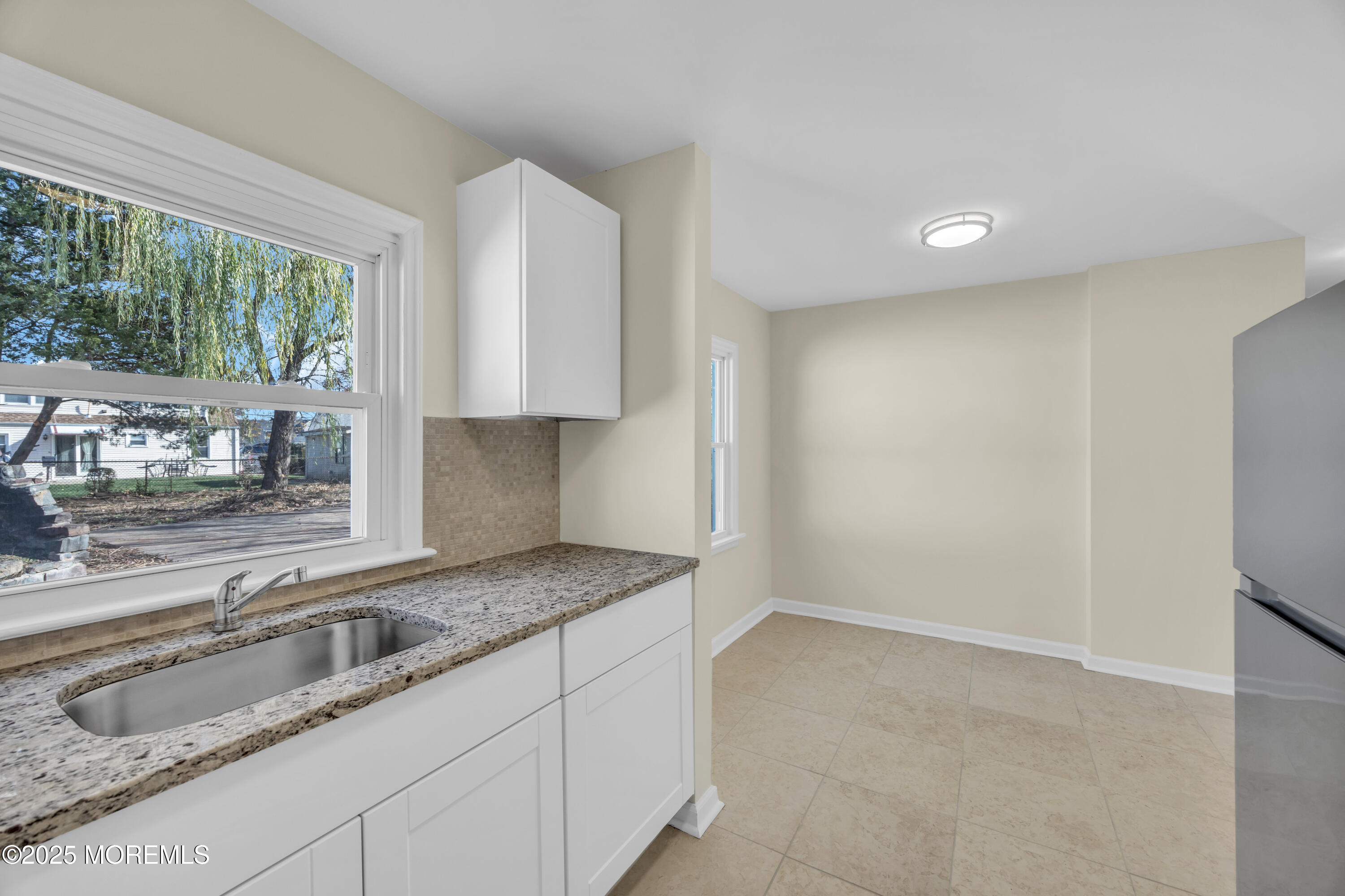 11 Randolphville Road Piscataway, NJ 08854 - Photo 14 of 27 a kitchen with granite countertop a sink a stove and a granite counter top