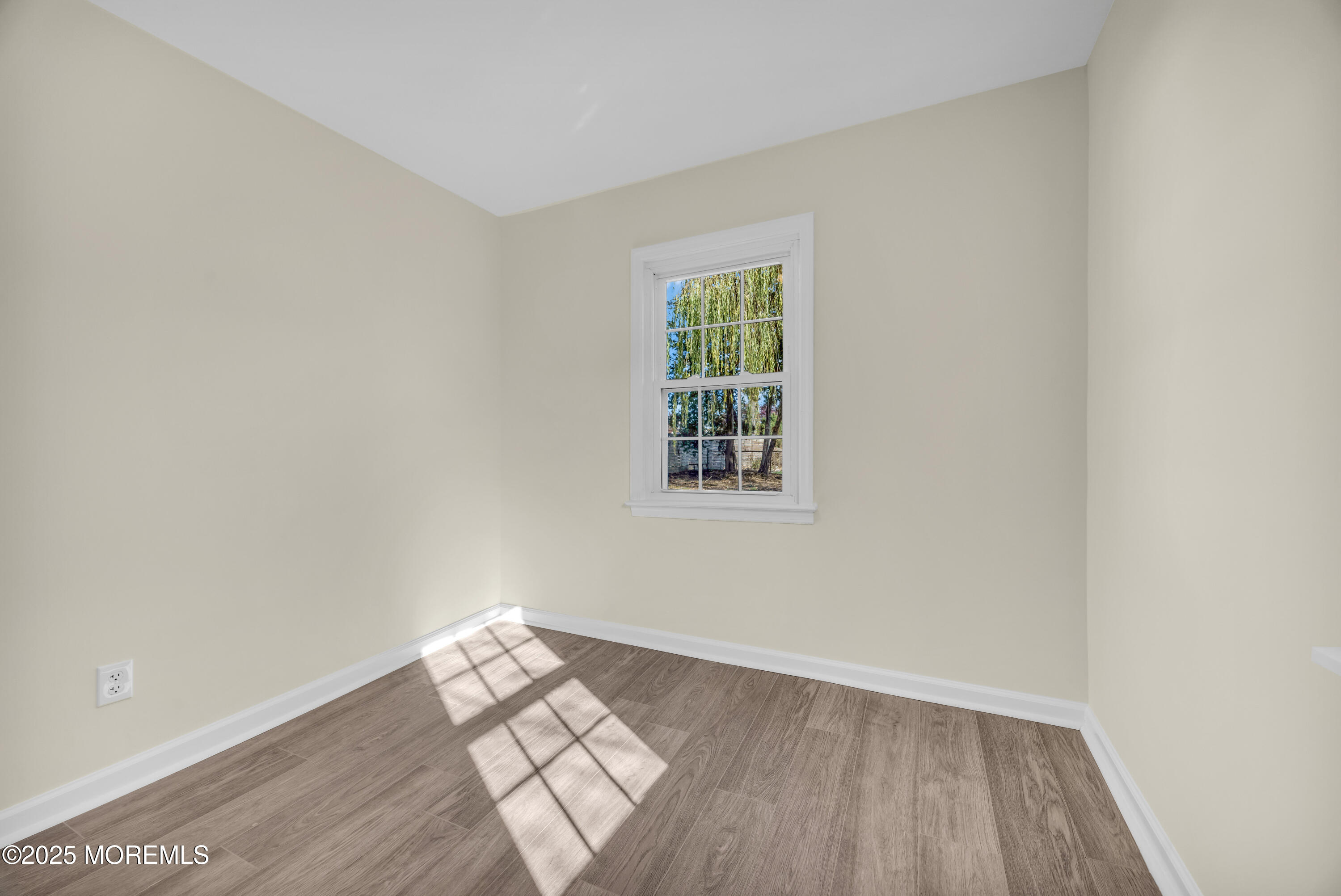 11 Randolphville Road Piscataway, NJ 08854 - Photo 17 of 27 an empty room with wooden floor and windows