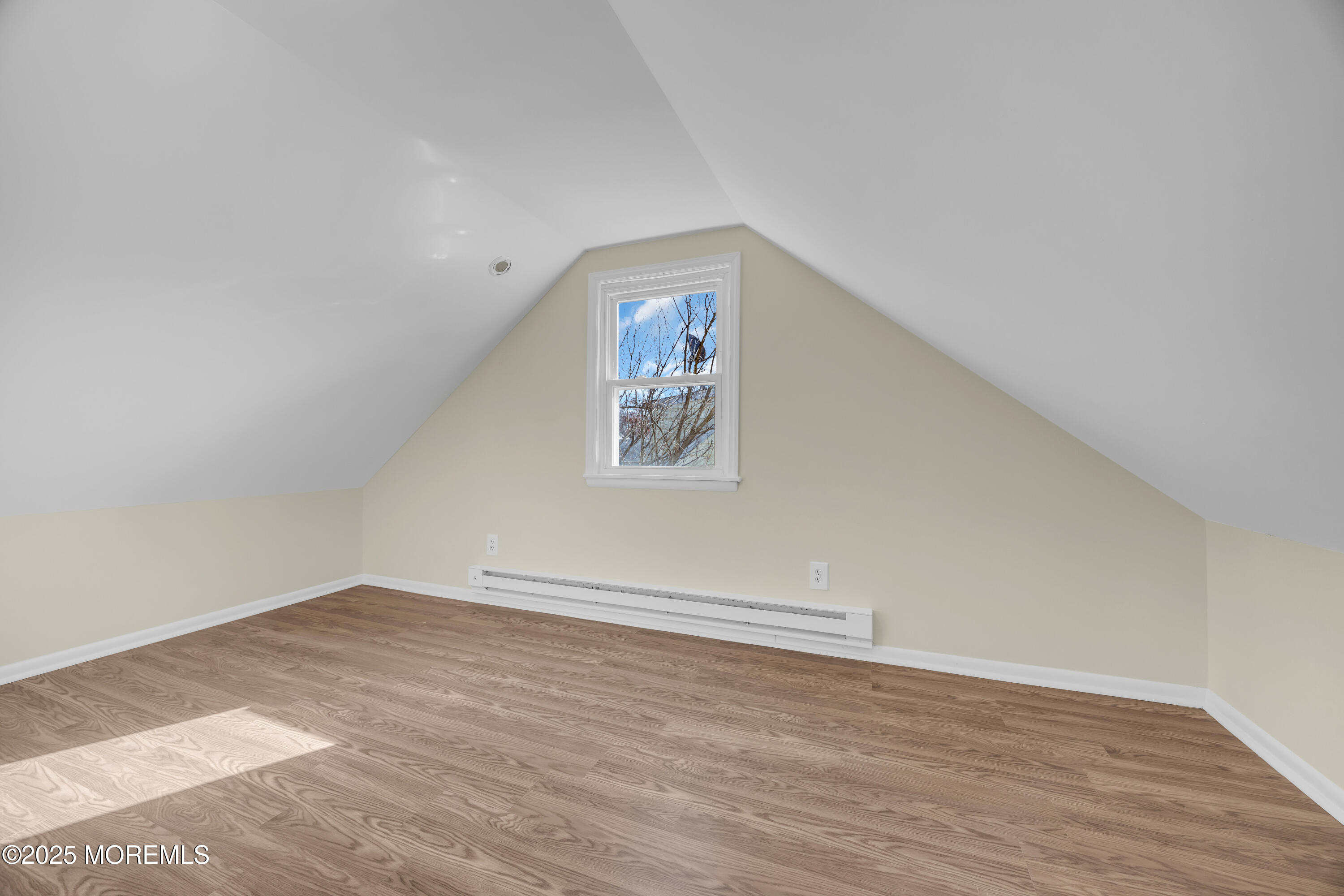 11 Randolphville Road Piscataway, NJ 08854 - Photo 22 of 27 an empty room with wooden floor and windows