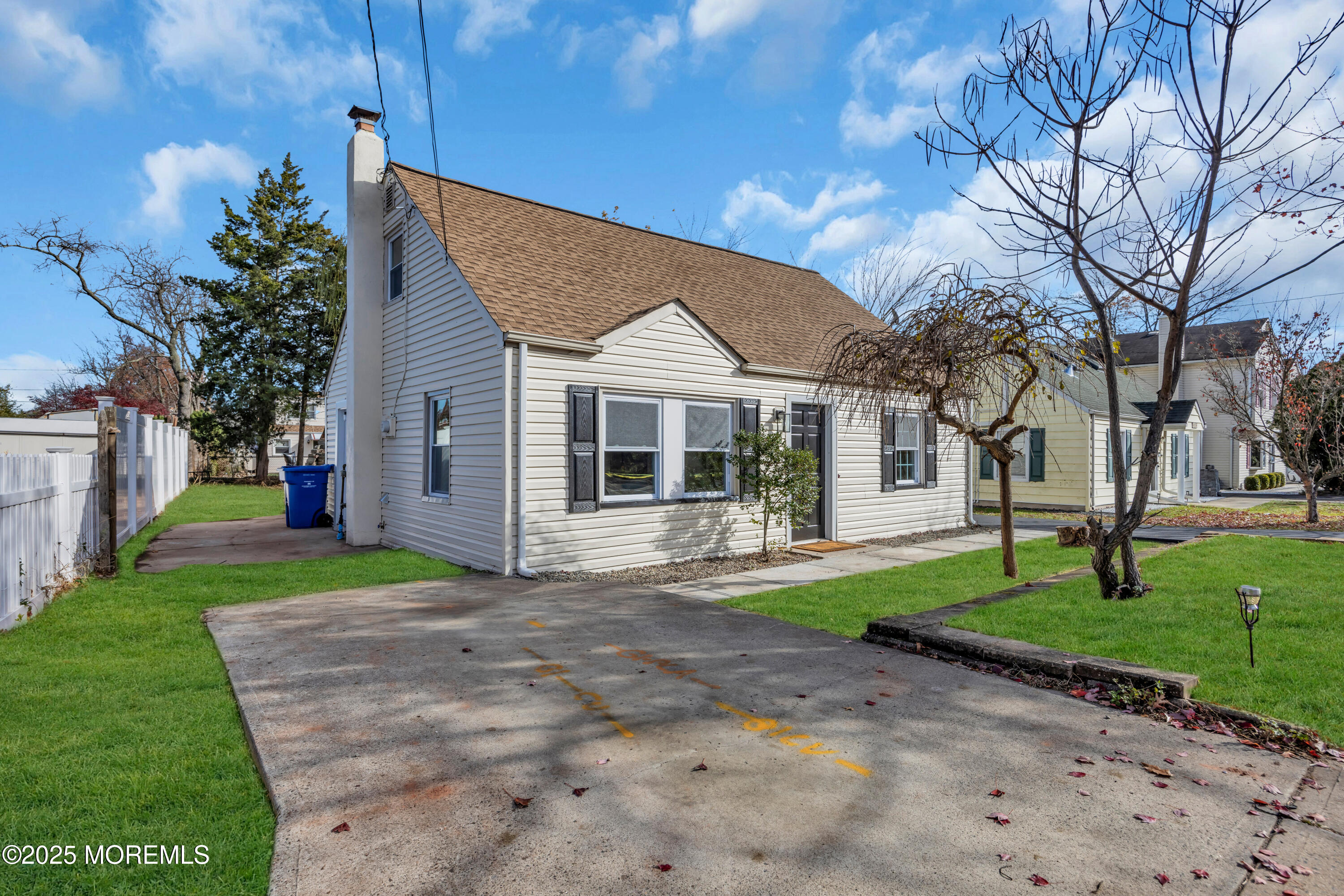 11 Randolphville Road Piscataway, NJ 08854 - Photo 3 of 27 a front view of a house with a garden and trees