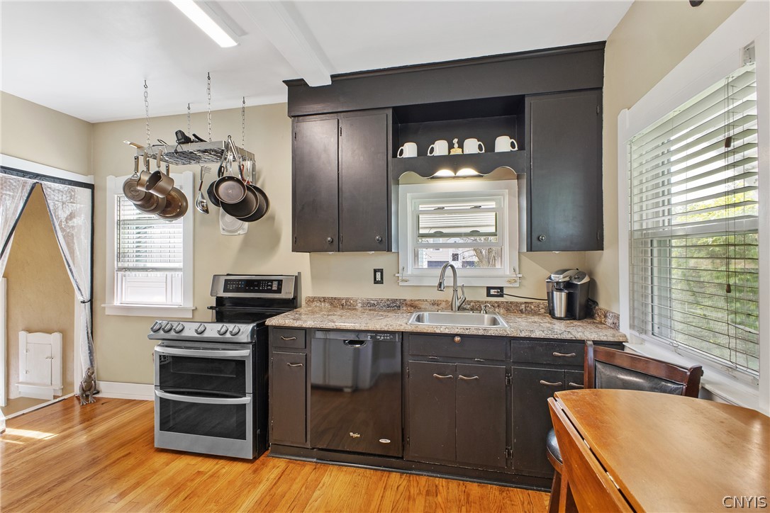 149 Harding Street Syracuse, NY 13208 - Photo 17 of 43 The sunny eat-in kitchen with large cabinetry